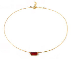 Gold chain necklace with green emerald quartz pendant.