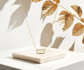 Timeless opal pendant necklace with adjustable chain.