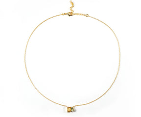 Toi Et Moi style necklace with green and yellow gemstones.