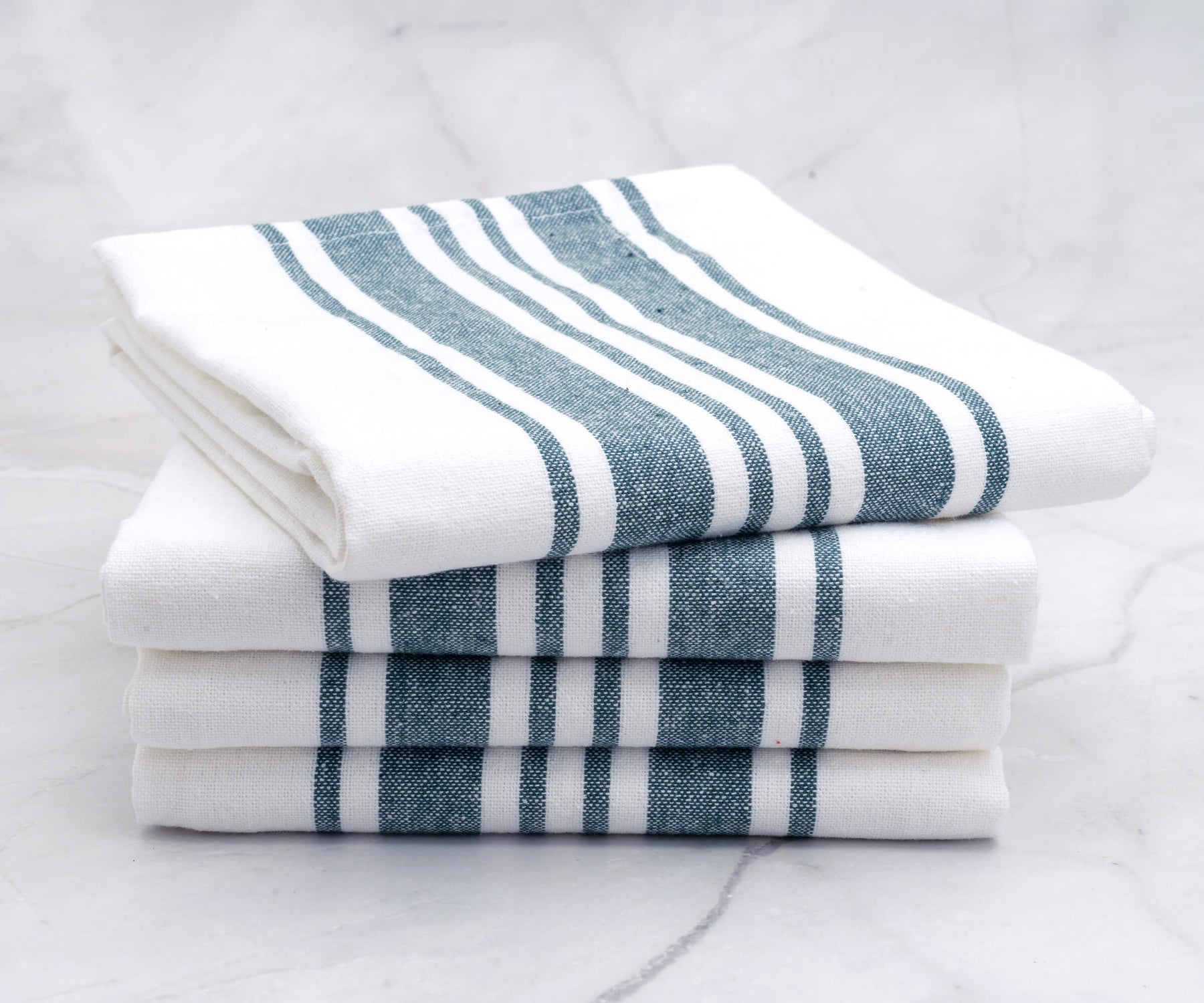 An arrangement of blue and white striped kitchen towels neatly stacked