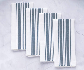 Set of four napkins featuring a blue and white striped pattern