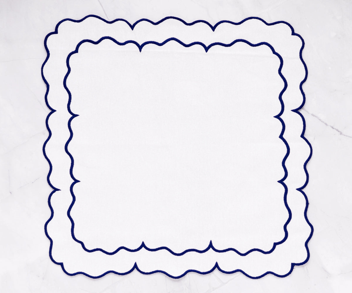 Blue white scalloped napkins with a unique edge design for a stylish touch.
