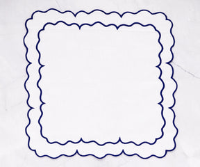 Blue white scalloped napkins with a unique edge design for a stylish touch.