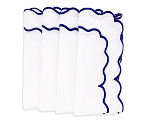 Blue scalloped napkins with a unique edge design for a stylish touch.