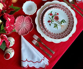 Red Scalloped edge napkins crafted with intricate detailing for refined table settings.
