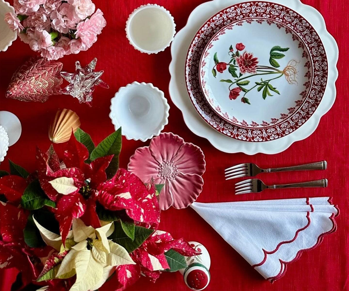 Red scalloped edge napkins offering a touch of refinement to your table decor