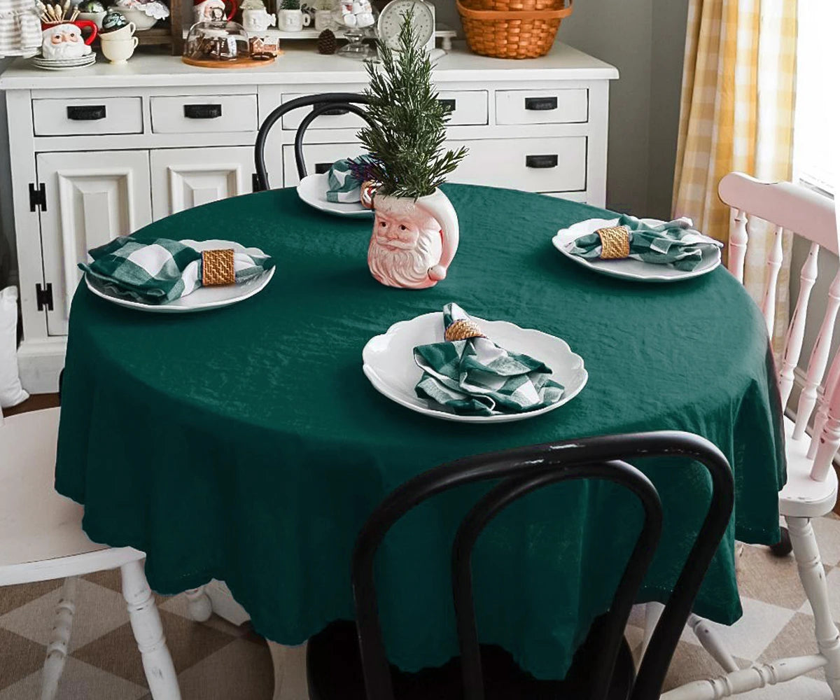 Green round tablecloth with elegant hemstitched border for dining tables
