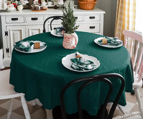 Green round tablecloth with elegant hemstitched border for dining tables
