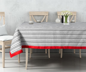 Striped tablecloths feature stripes of varying widths and colors running either horizontally or vertically across the fabric. 