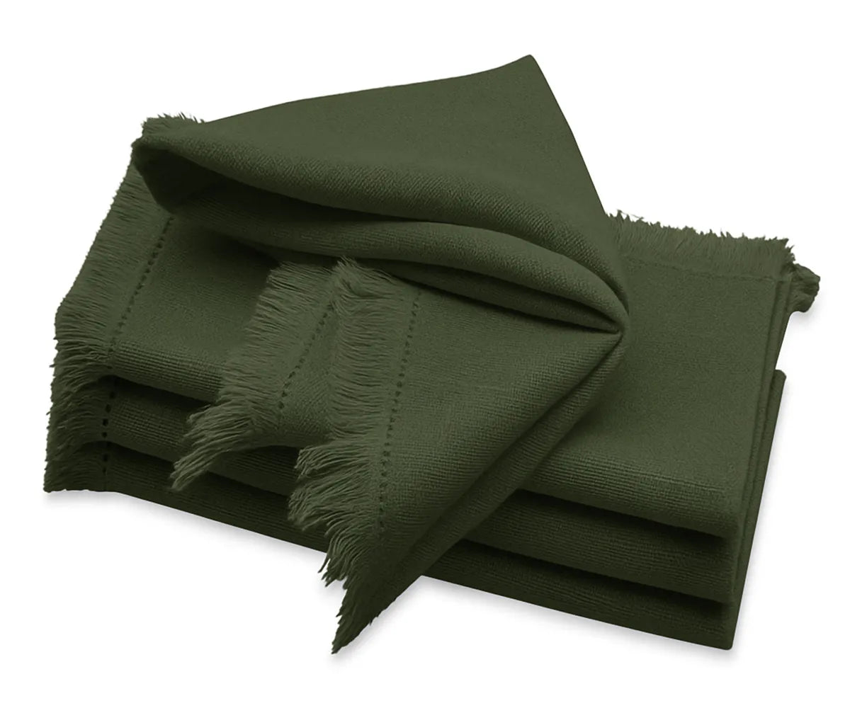 Olive Green Fringe Cloth Napkins neatly folded on a dining table with a checked cotton tablecloth