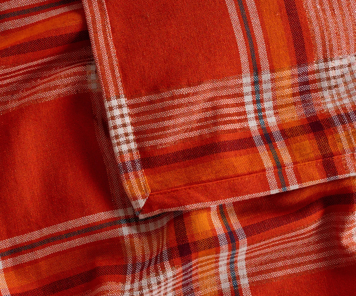 Bright orange and black checkered cotton tablecloth perfect for farmhouse or holiday decor