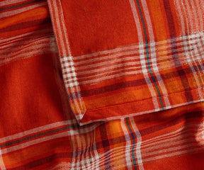 Bright orange and black checkered cotton tablecloth perfect for farmhouse or holiday decor