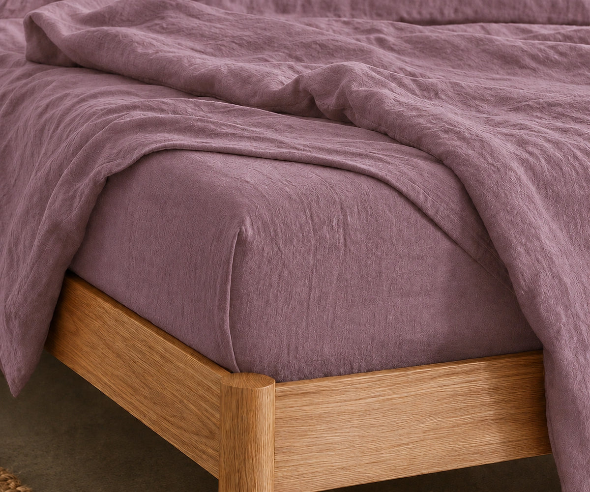 Organic linen bedding in dusty mauve for breathable and eco friendly sleep comfort