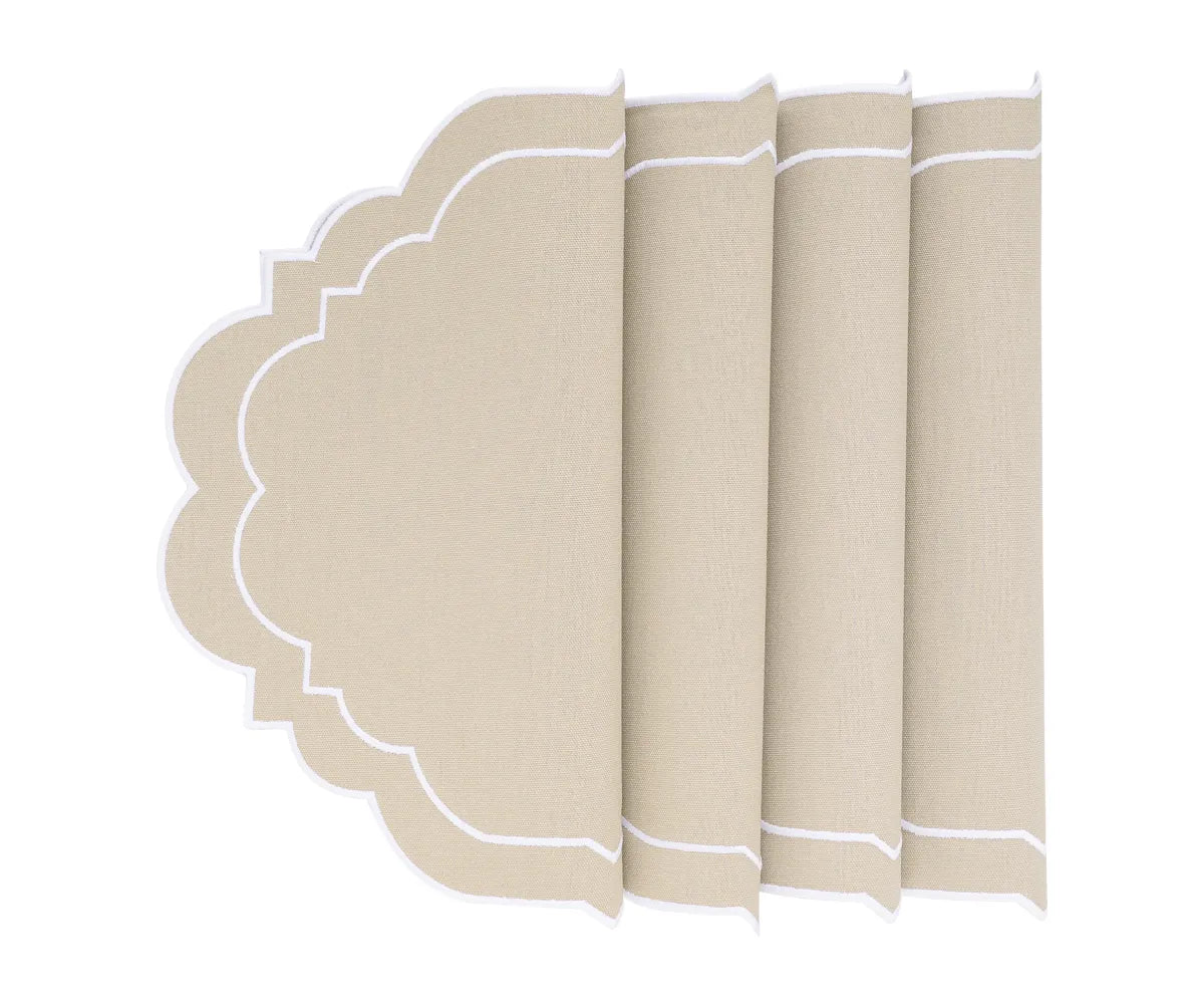 Close-up of scalloped edge on beige cotton placemat