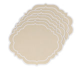Beige oval placemats with scalloped edges on a wooden dining table