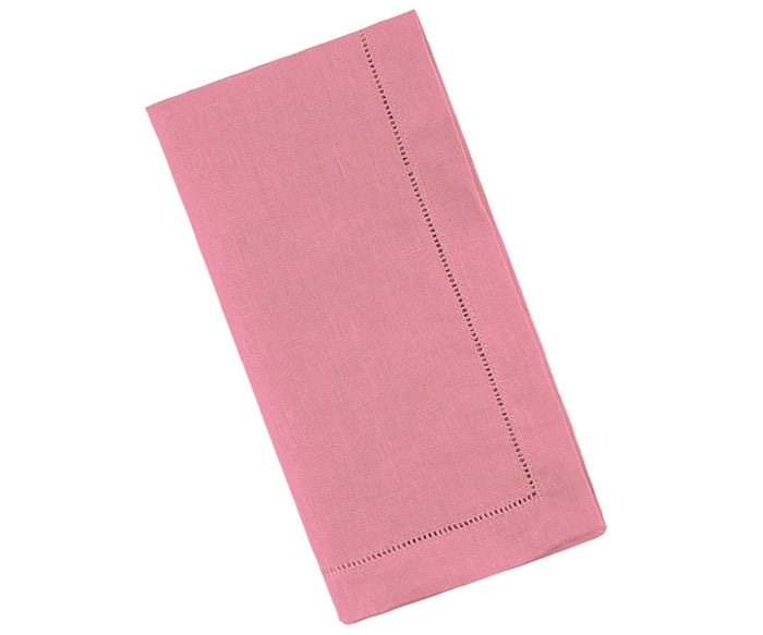 A light pink linen napkin with a classic hemstitch pattern.
