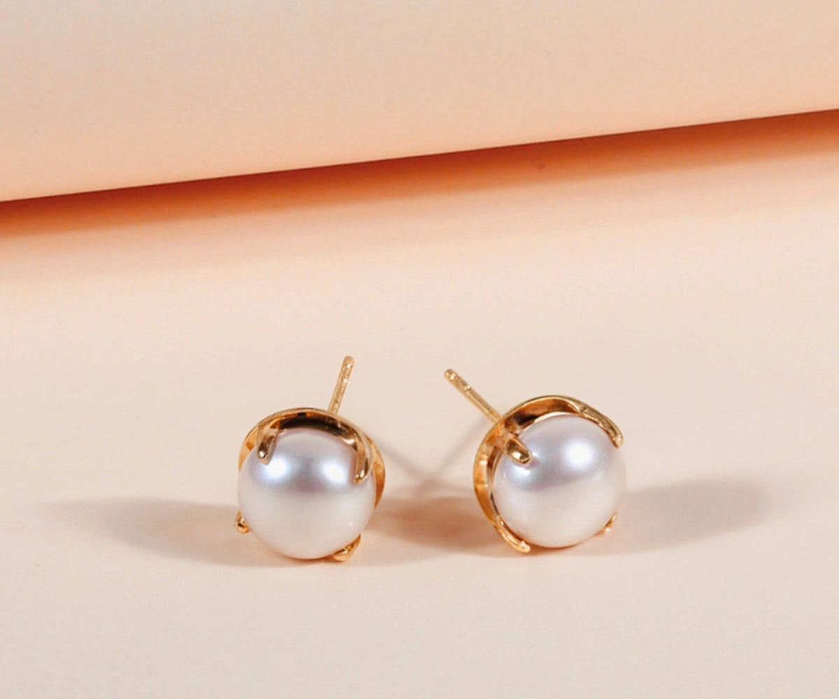 Sophisticated women's pearl earrings showcasing 10mm freshwater pearls and polished gold finish.