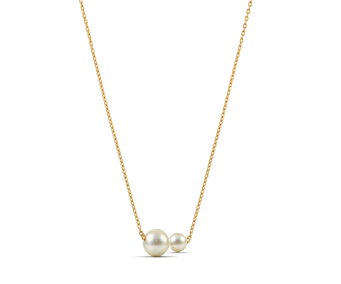 Freshwater pearl pendant necklace styled with modern gold jewelry accessories