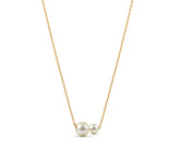 Freshwater pearl pendant necklace styled with modern gold jewelry accessories