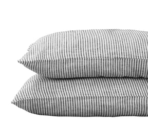 Black and white striped linen pillowcases set of 2 in Standard, Queen, and King sizes – breathable and soft 100% linen covers on a bed.