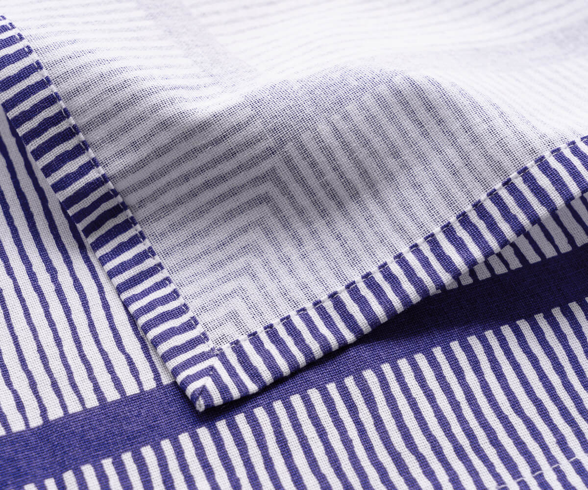 blue striped napkins bring a refreshing and calming aesthetic to any table setting