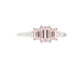 Rose quartz ring showcasing soft pink stone with zircon sparkle details