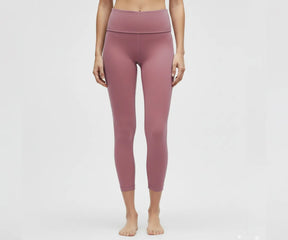 High-waisted pink women's leggings for yoga, gym, and casual wear, breathable cotton blend with stretchy, supportive waistband.