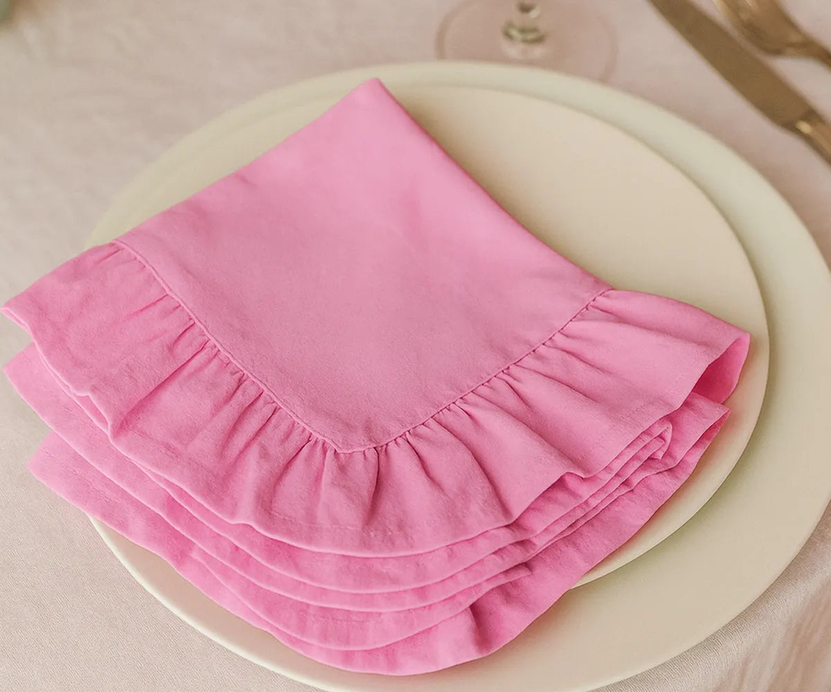 Pink cotton ruffle edge dinner napkins, soft and reusable cloth napkins for weddings, showers, holidays, and everyday family dining table décor.