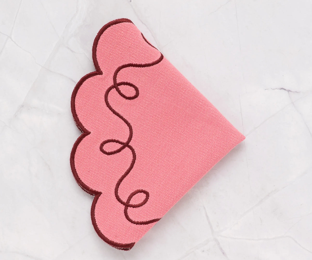 Delicate pink round tablemat made from 100% cotton, finely stitched scallop edge, reusable and machine washable for daily meals and parties