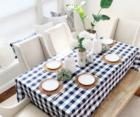 A checkered tablecloth, often red and white or other colors, adds a charming and rustic touch to a table, reminiscent of classic picnics.