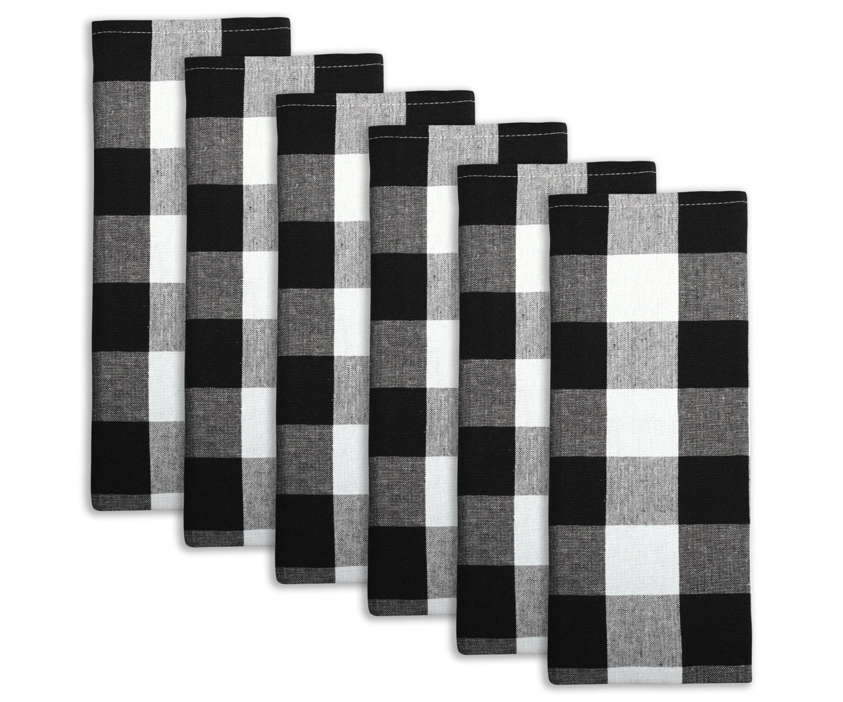 Quartet of black and white checkered cotton kitchen towels neatly arranged