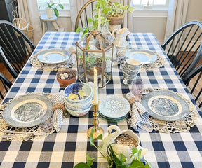 A blue and white tablecloth with subtle patterns or motifs can add visual interest without overpowering the overall décor.