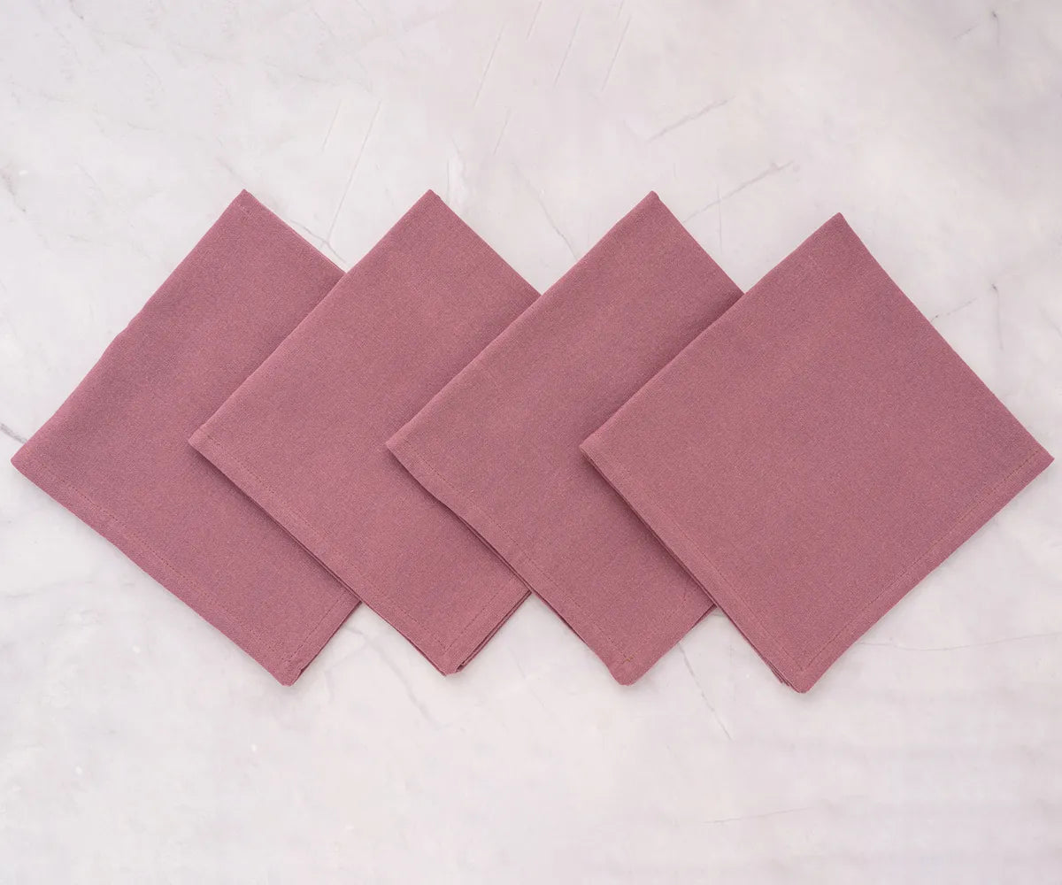 Cotton dinner napkins paired with striped tablecloth