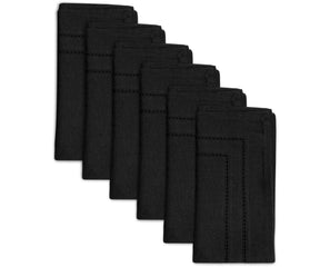 Stylish black napkins displayed alongside silverware, enhancing the table's aesthetic with a chic, minimalist touch.