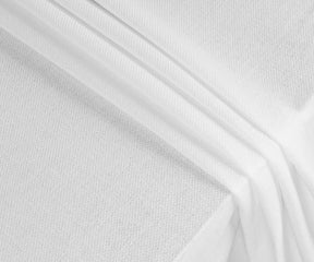 Soft, durable white cotton tablecloth in multiple sizes, perfect for formal occasions, casual family dinners, or outdoor picnics, adding effortless elegance.