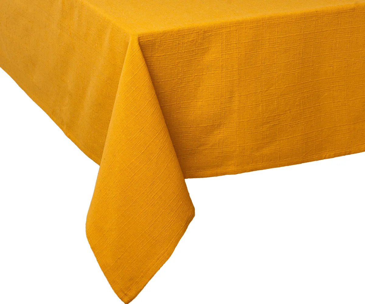 Plain yolk 100% cotton tablecloth with outdoor garden setting