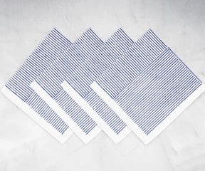 Napkin set with line print pattern displayed on a festive dining table	