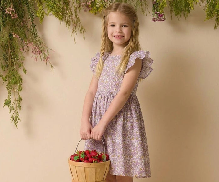 Toddler girl floral dress in soft cotton fabric with ruffle sleeves and strawberry basket.
