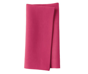 Neatly ironed solid cotton napkins with tableware
