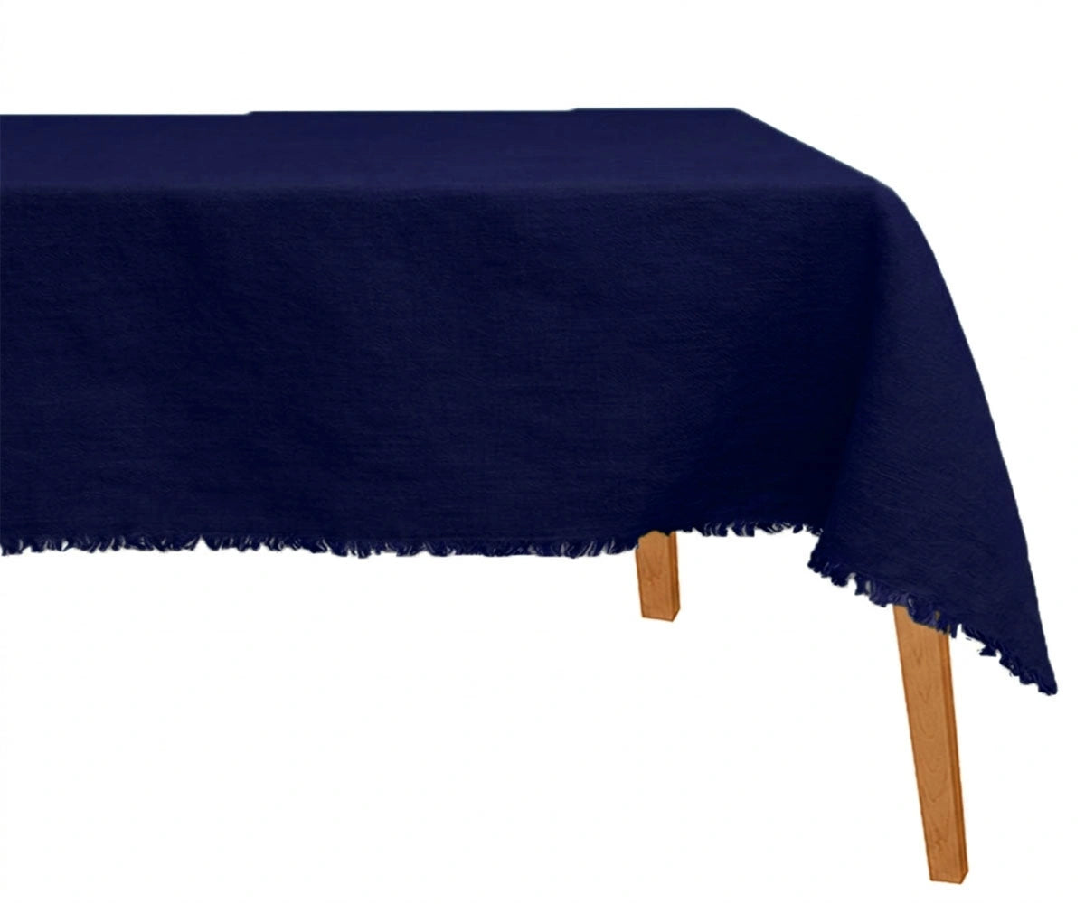 Deep navy raw edge linen tablecloth styled for formal dining and modern table decor