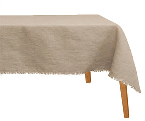Beige raw edge linen tablecloth draped elegantly for wedding and formal dinner tables