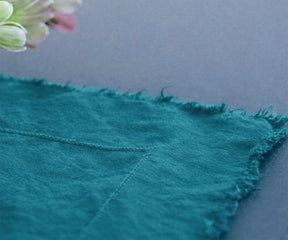 Teal 100% European linen tablecloth with soft drape and raw edge detail for elegant dining table linen