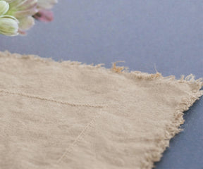 Warm beige linen tablecloth in premium European flax linen for neutral dining room decor
