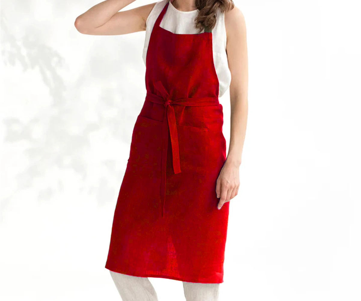 Red linen apron for kitchen and cooking, lightweight and breathable with adjustable fit.