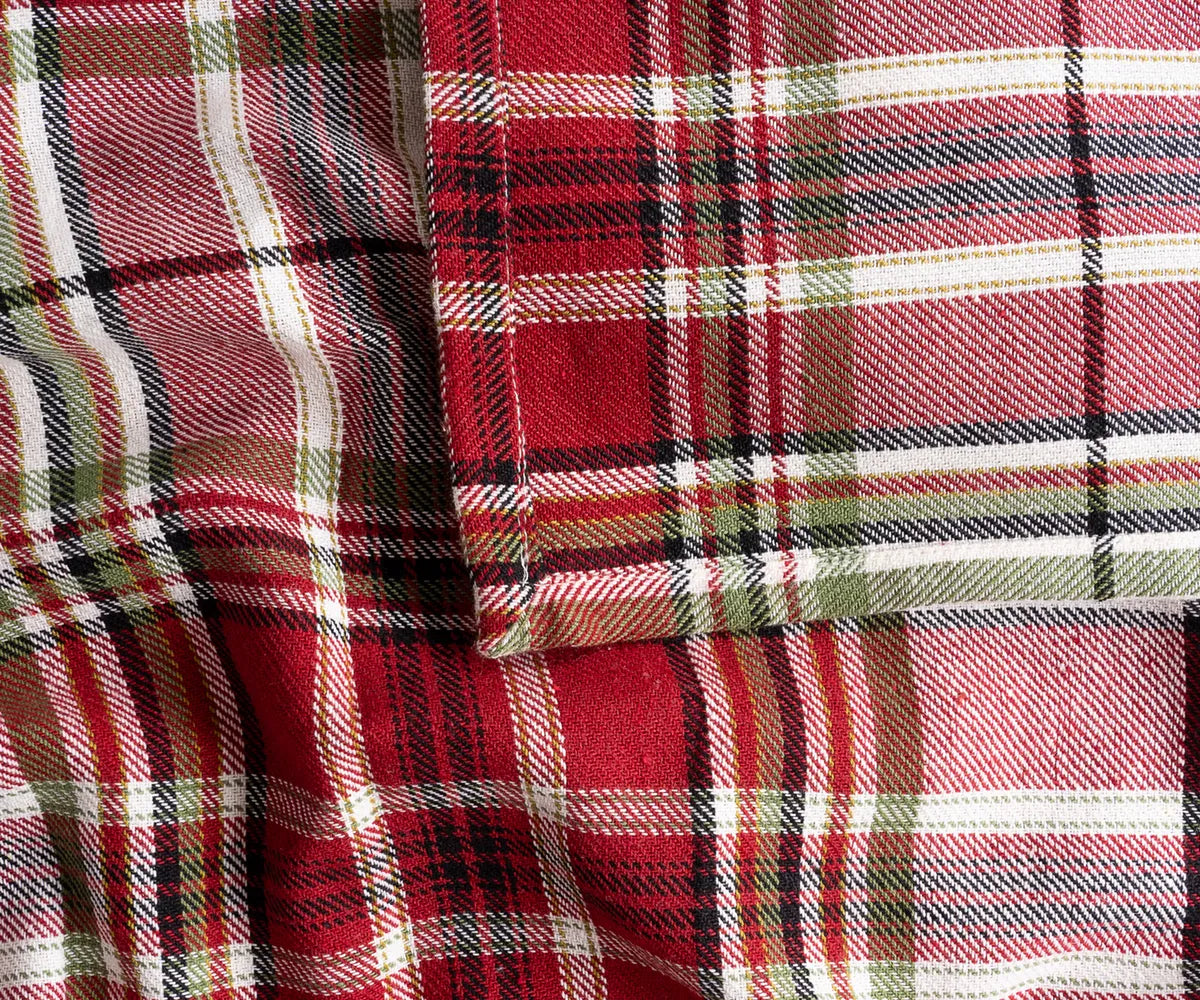 Elegant red and green plaid fabric tablecloth for rustic or traditional dining room setup