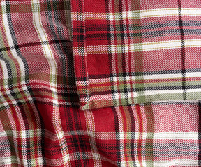 Elegant red and green plaid fabric tablecloth for rustic or traditional dining room setup