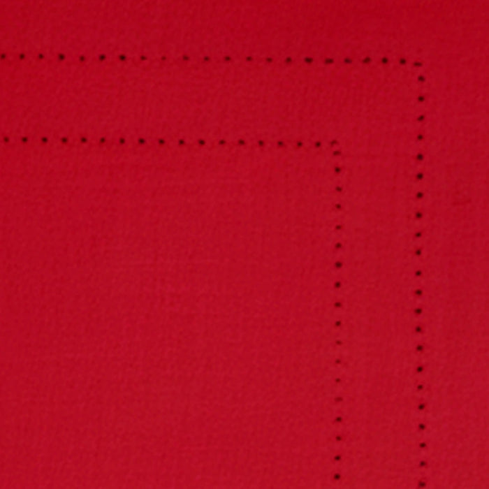 Festive table setup with red cotton hemstitch placemats for holiday dining