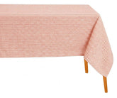 Rectangular red and white horizontal striped cotton tablecloth draped over a wooden table against a white background
