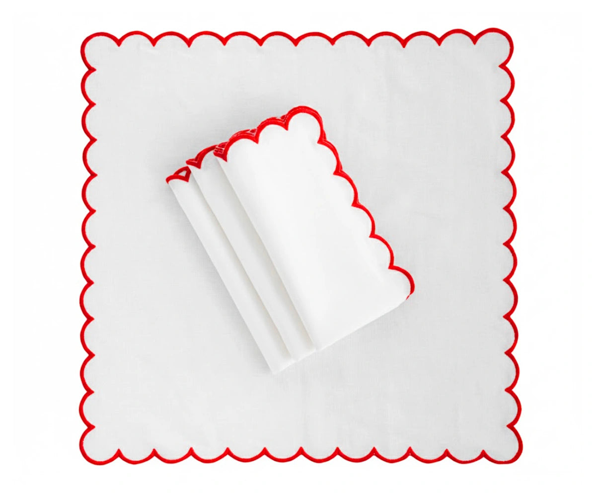 Deep red cloth napkin placed on a dining plate, soft table napkin