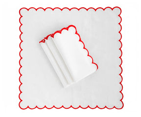 Deep red cloth napkin placed on a dining plate, soft table napkin